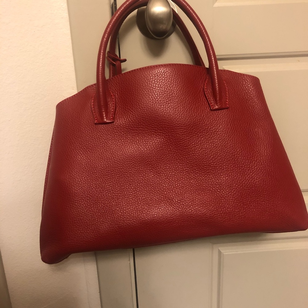 Red leather handbag